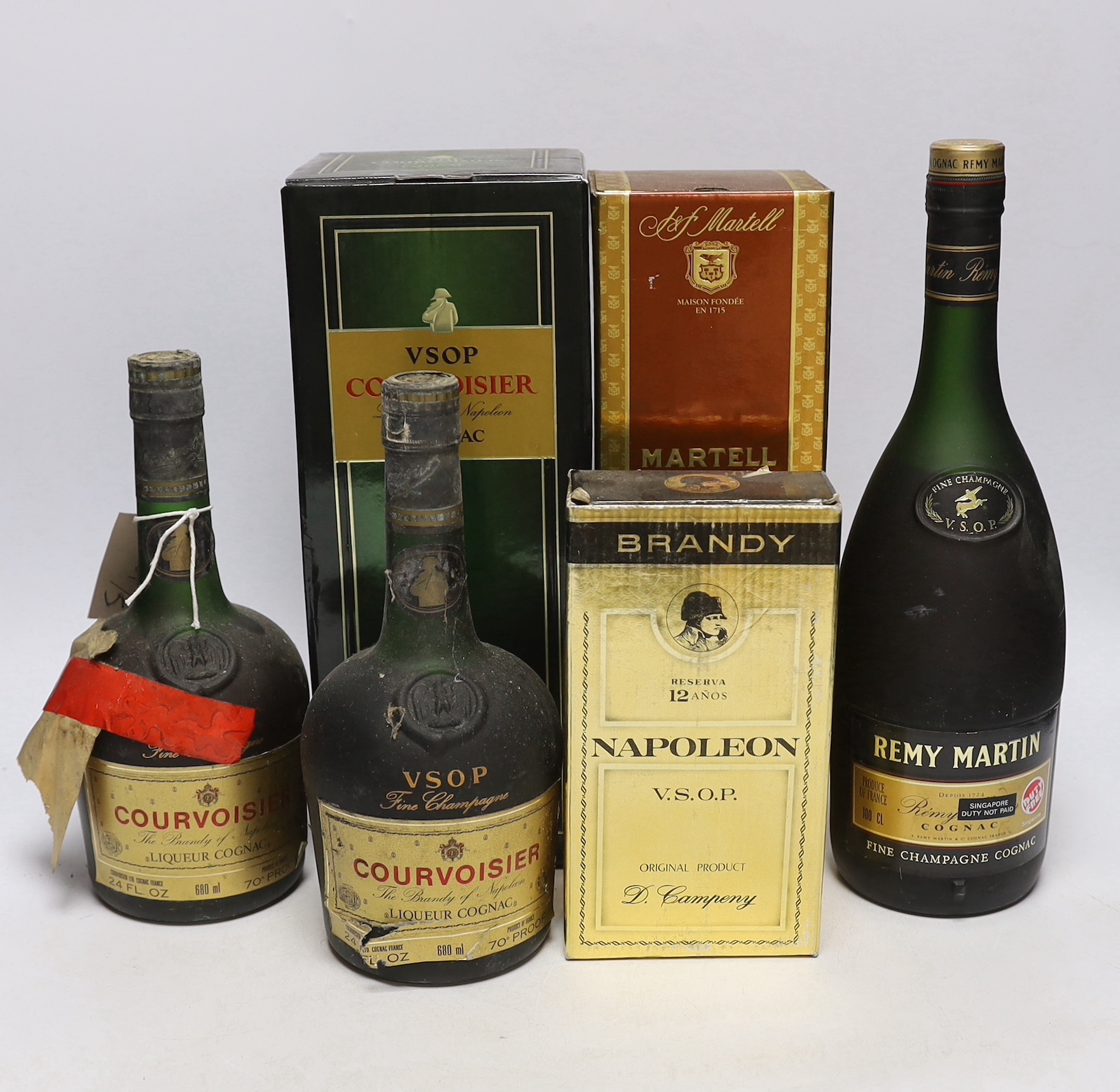 Six bottles of Brandy / Cognac; three bottles of Courvoisier, a Remy Martin, a Napoleon and a Martell